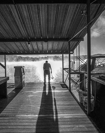 MARINA ATTENDANT ON A FOGGY MORNING